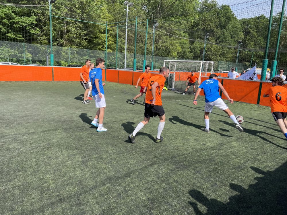 Qair employees playing football during renewable energy tournament