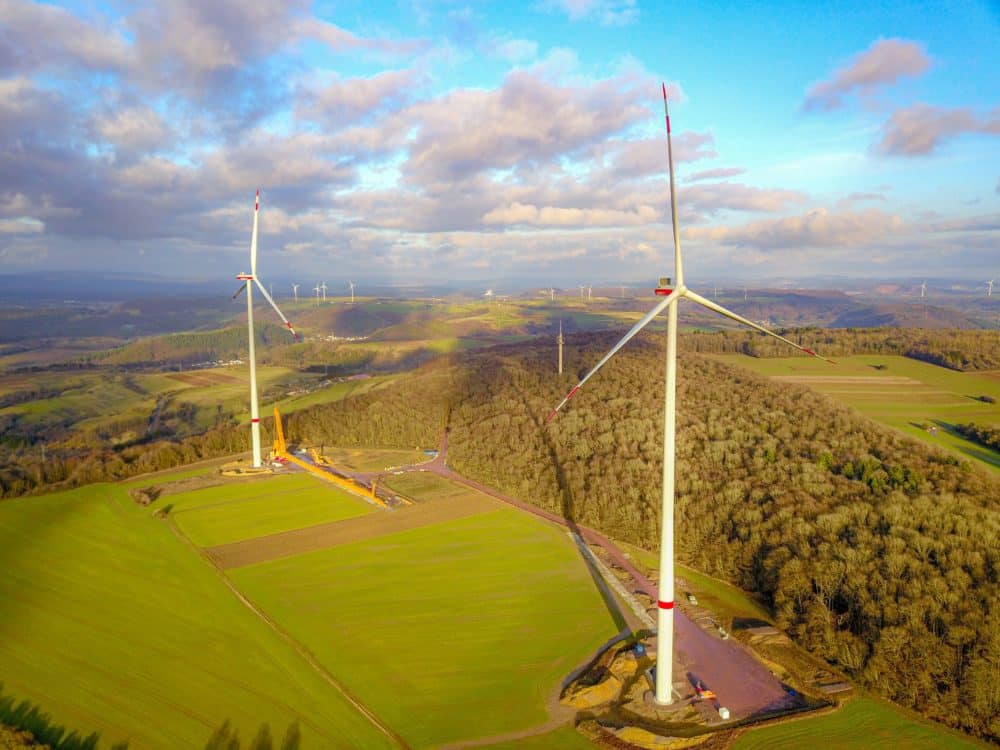The two wind turbines of Qair's Merzig project, on a field
