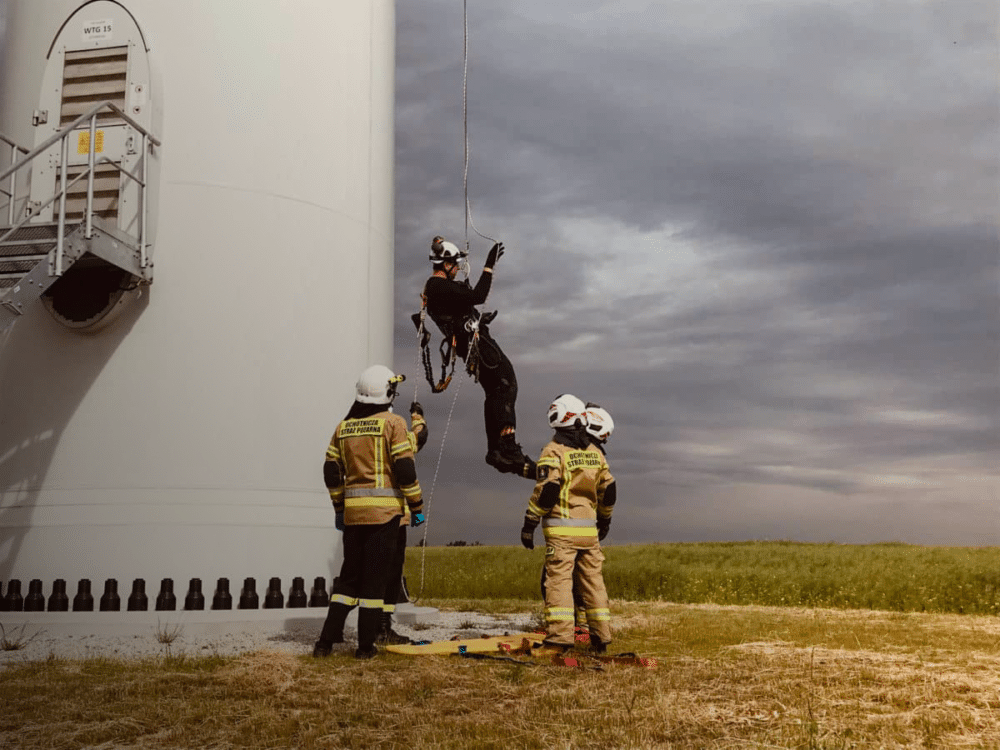 Photo of a safety drill on a Qair wind turbine